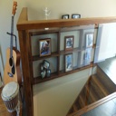 Custom Designed and Built Glass Handrail and Built-in Wall Shelving