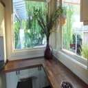 Custom Built Breakfast Nook with Walnut Veneer Counter Tops and shallow Under-counter Storage Cabinets